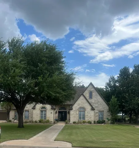 a view of house with outdoor space