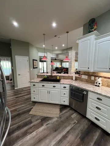 a large kitchen with cabinets