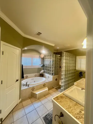 a view of a bathroom with a tub and mirror