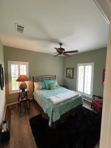 a bedroom with a bed furniture and a window