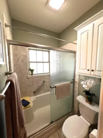 a bathroom with a toilet and a sink