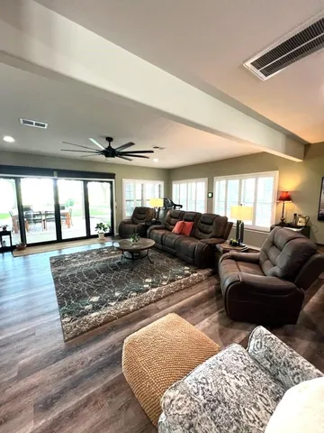 a living room with furniture and a rug