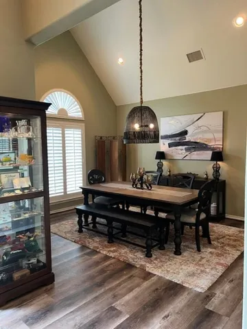 a view of a dining room with furniture window and wooden floor