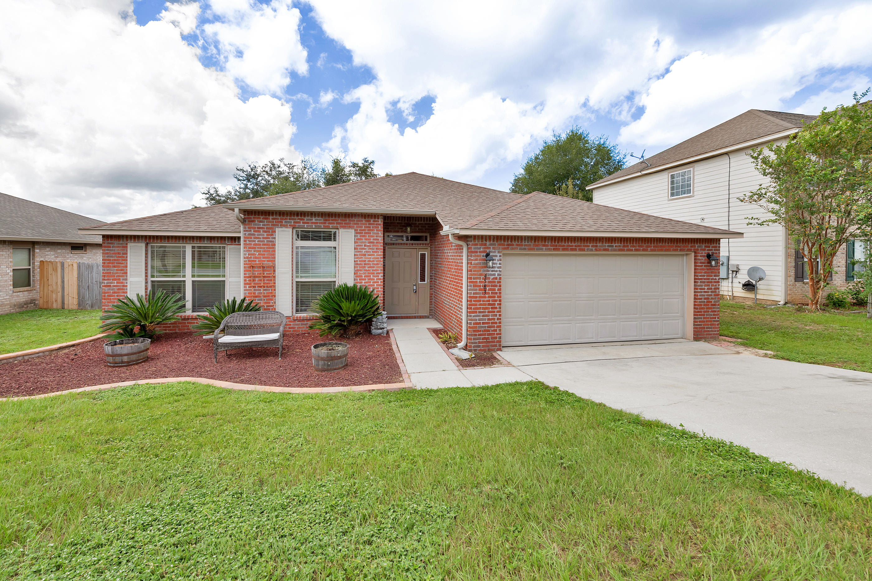 4583 Hermosa Road Crestview, FL 32539 - Photo 2 of 24 a view of a house with a patio