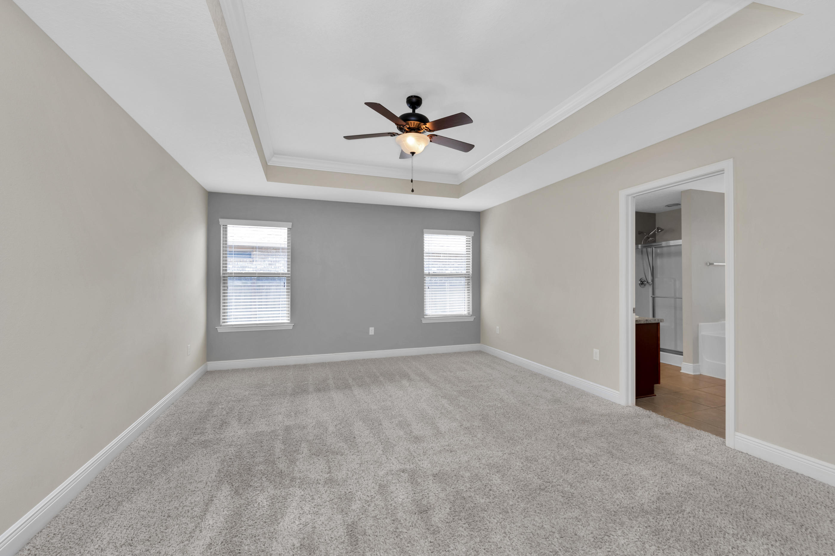 4583 Hermosa Road Crestview, FL 32539 - Photo 16 of 24 a view of a livingroom with a ceiling fan & windows