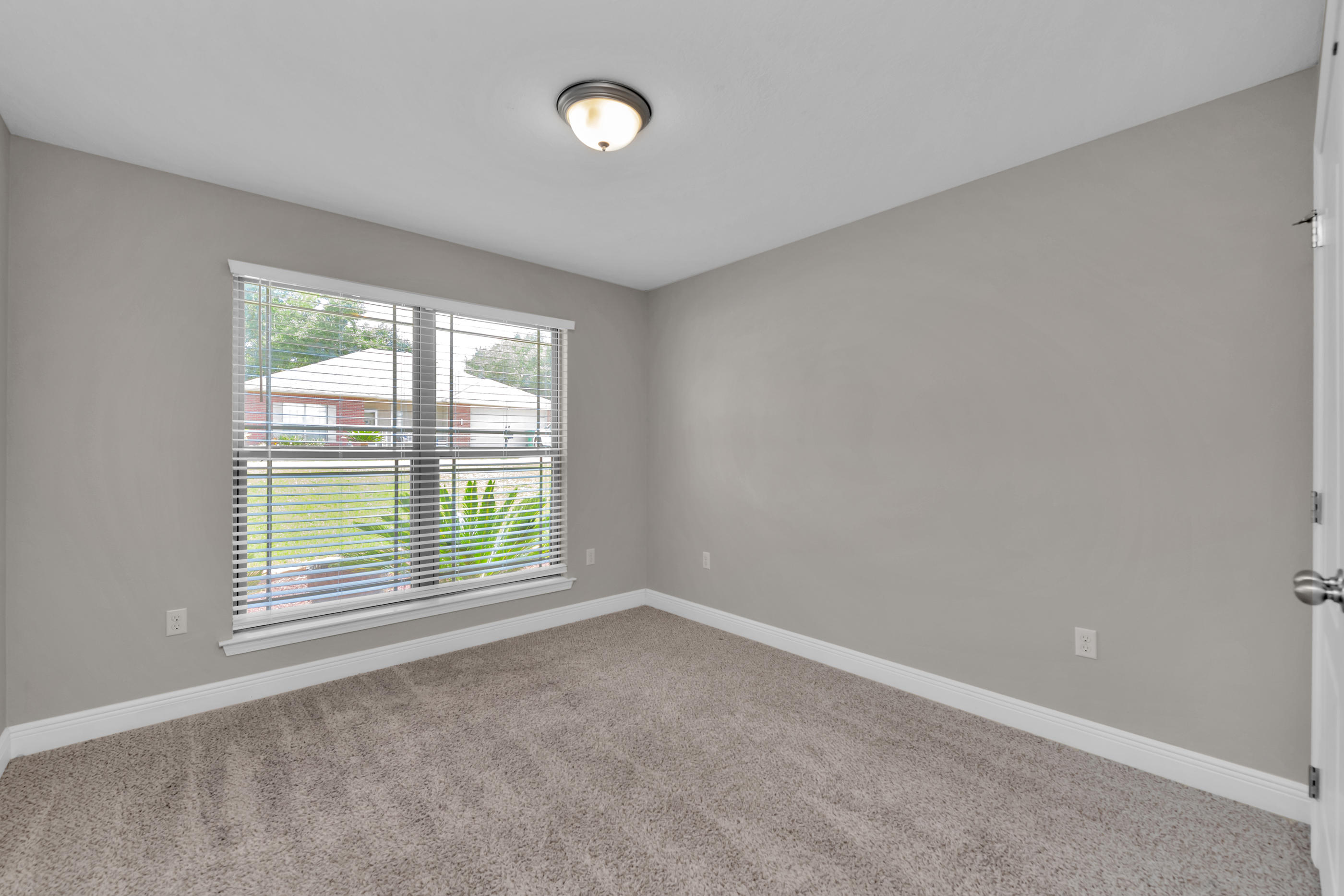 4583 Hermosa Road Crestview, FL 32539 - Photo 19 of 24 an empty room with windows