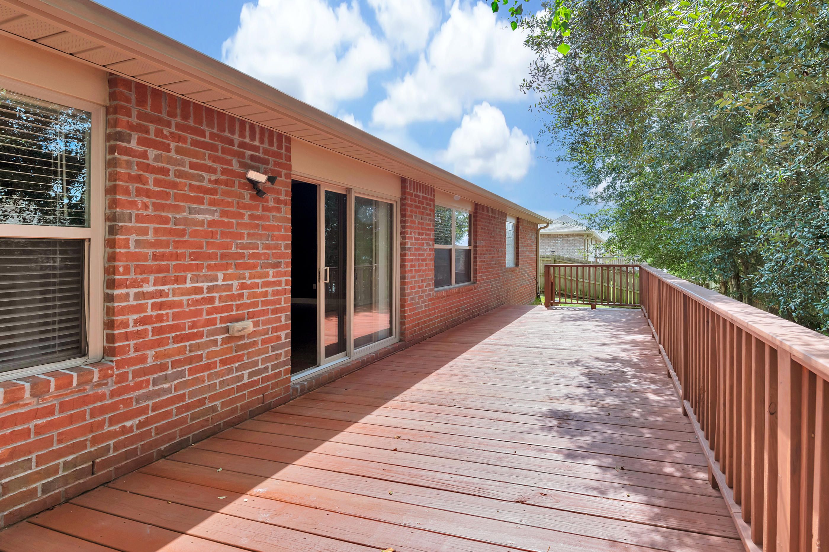 4583 Hermosa Road Crestview, FL 32539 - Photo 24 of 24 a view of backyard with deck and wooden floor