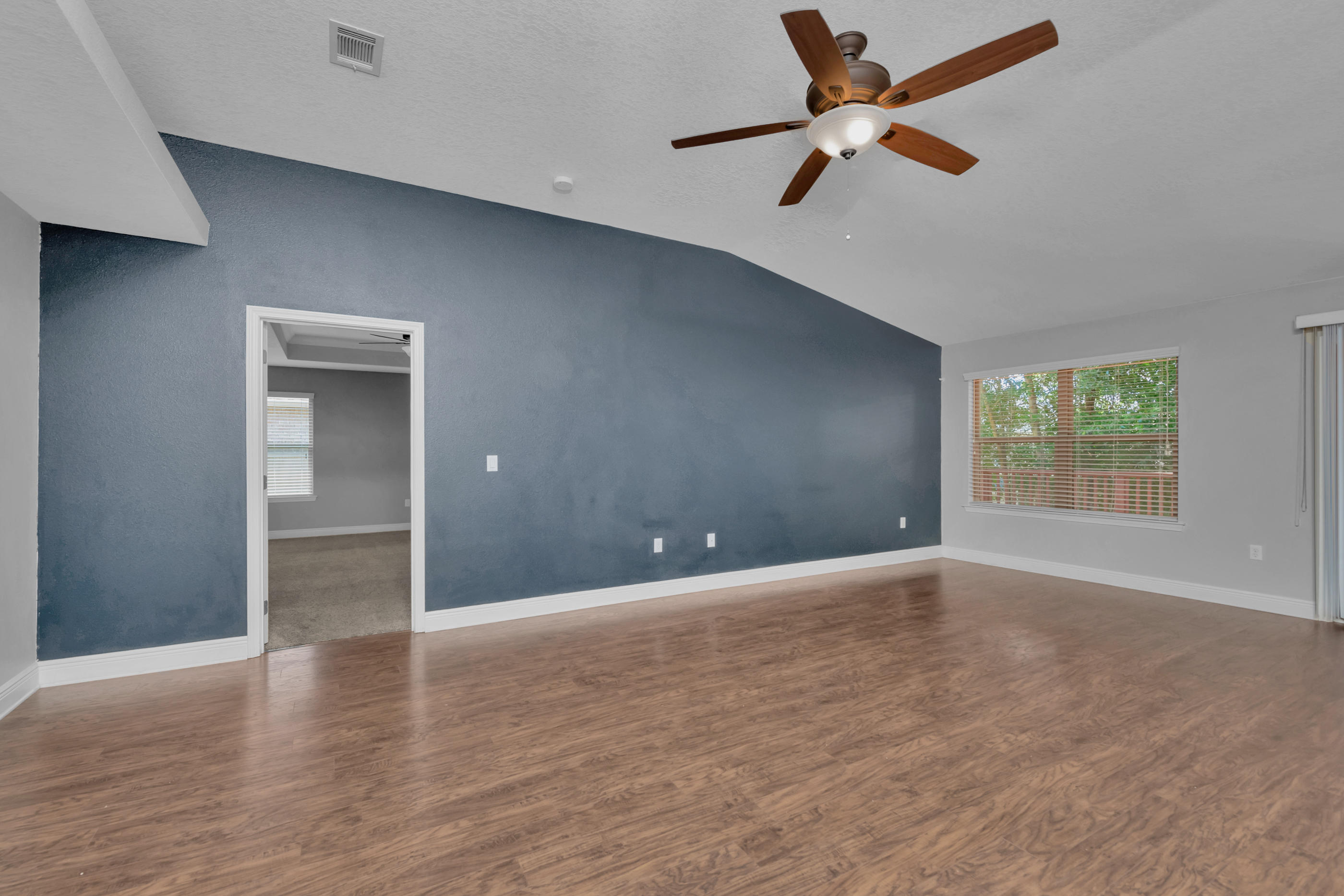 4583 Hermosa Road Crestview, FL 32539 - Photo 7 of 24 an empty room with fan and windows