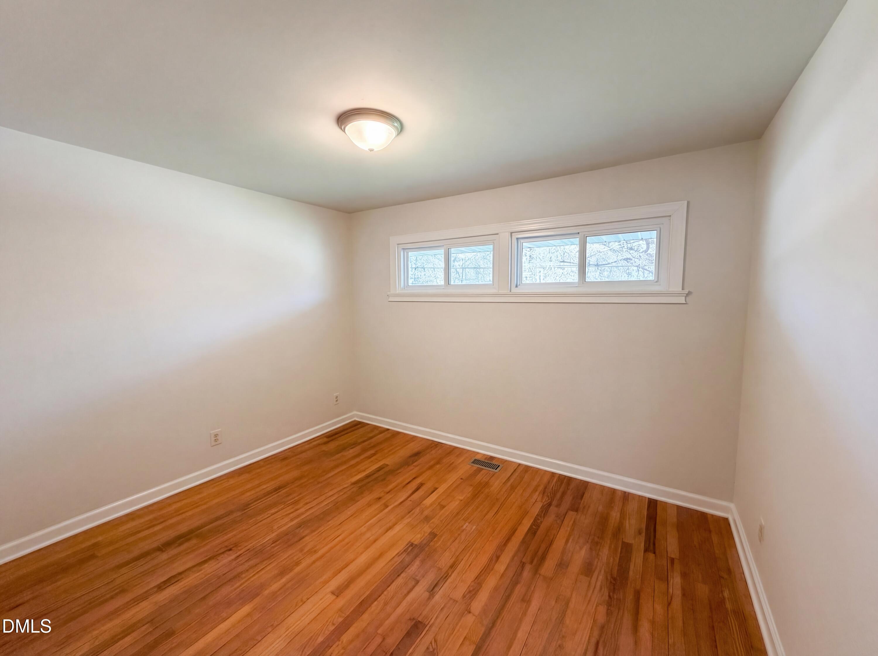 910 Devonport Drive Raleigh, NC 27610 - Photo 12 of 16 an empty room with a window