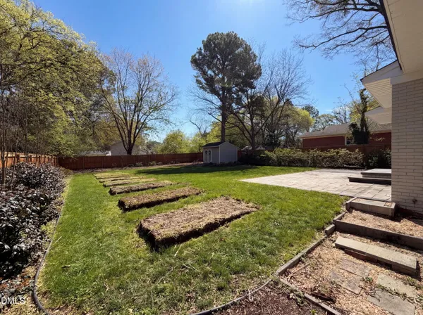 a view of a garden with an outdoor space