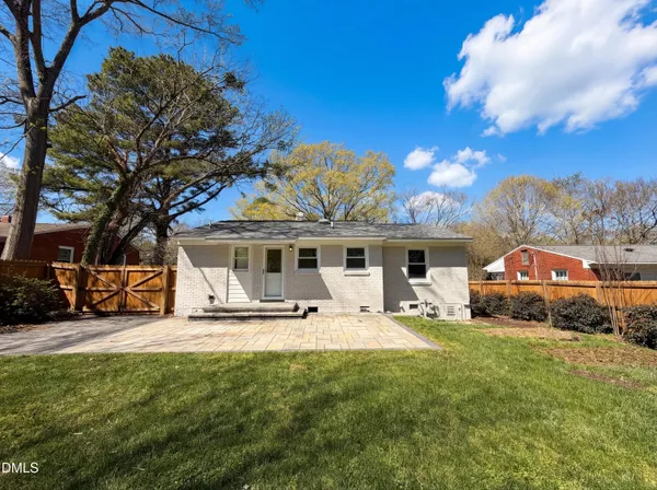 a house view with a sitting space and garden