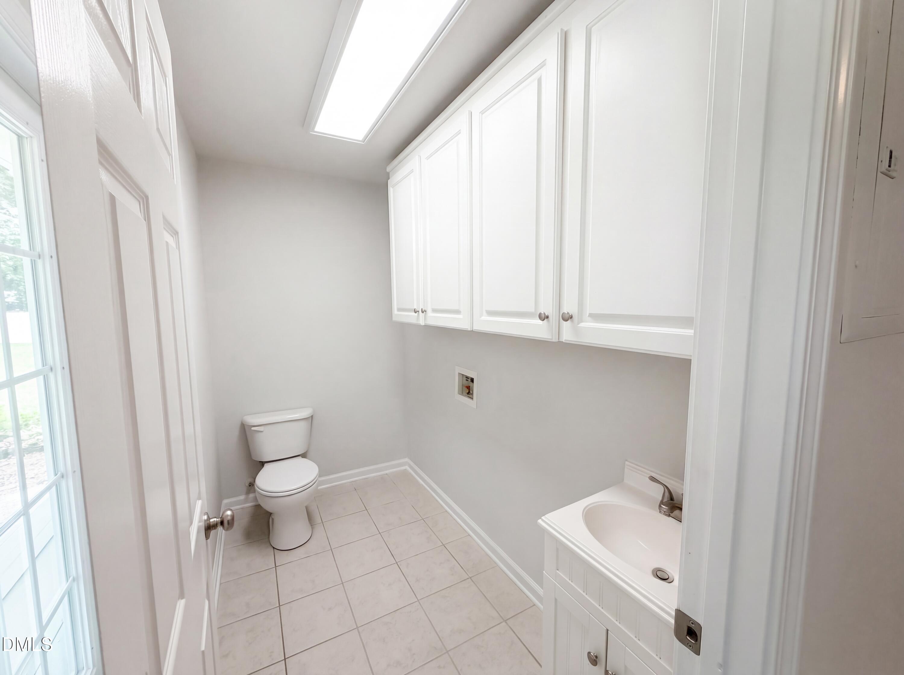 910 Devonport Drive Raleigh, NC 27610 - Photo 7 of 16 a bathroom with a toilet