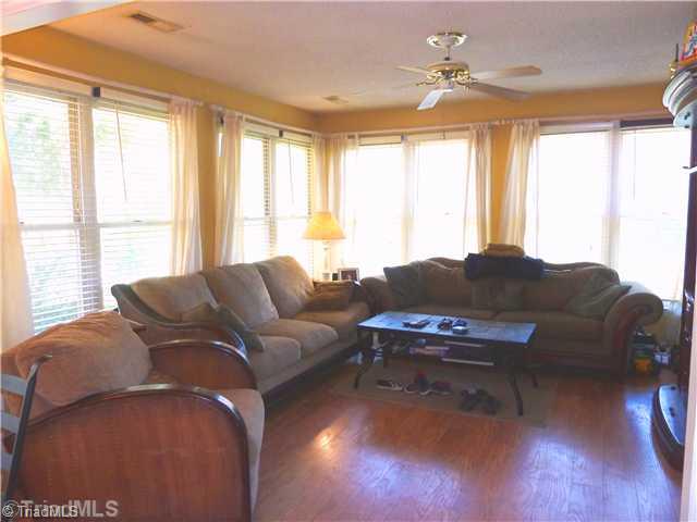3601 Single Leaf Court High Point, NC 27265 - Photo 5 of 16 Sunroom. Light-filled sunroom viewed from eat-in kitchen