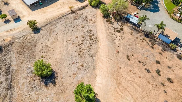 an aerial view of a houses with yard