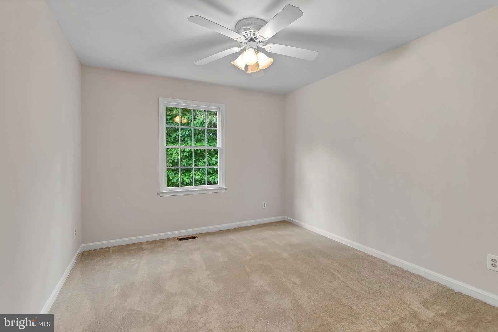 1010 Planters Wharf Road Lusby, MD 20657 - Photo 18 of 26 Upper level bedroom #2 w/ceiling fan ** new carpet