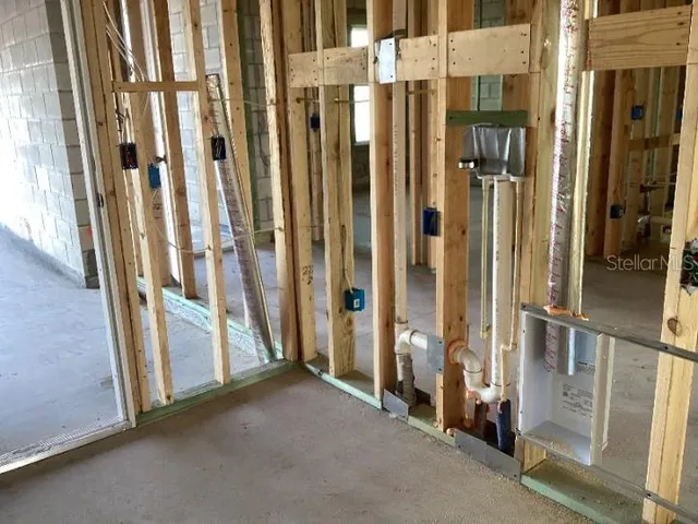 a view of a livingroom with wooden floor and entryway