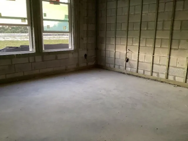 a view of a room with wooden floor and walls