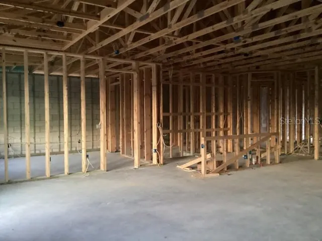 a view of an empty room with stairs