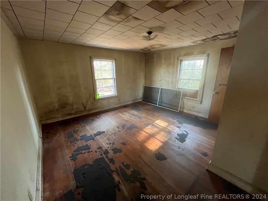 1712 Hayes Road Spring Lake, NC 28390 - Photo 11 of 13 a view of empty room with wooden floor