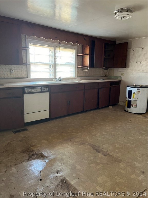 1712 Hayes Road Spring Lake, NC 28390 - Photo 12 of 13 a kitchen with stainless steel appliances kitchen island granite countertop a stove a sink and a microwave
