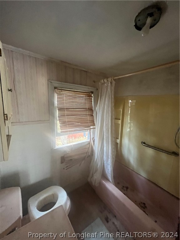 1712 Hayes Road Spring Lake, NC 28390 - Photo 10 of 13 a bathroom with a toilet and a shower