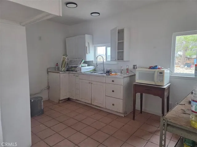 a spacious bathroom with a double vanity sink mirror and toilet