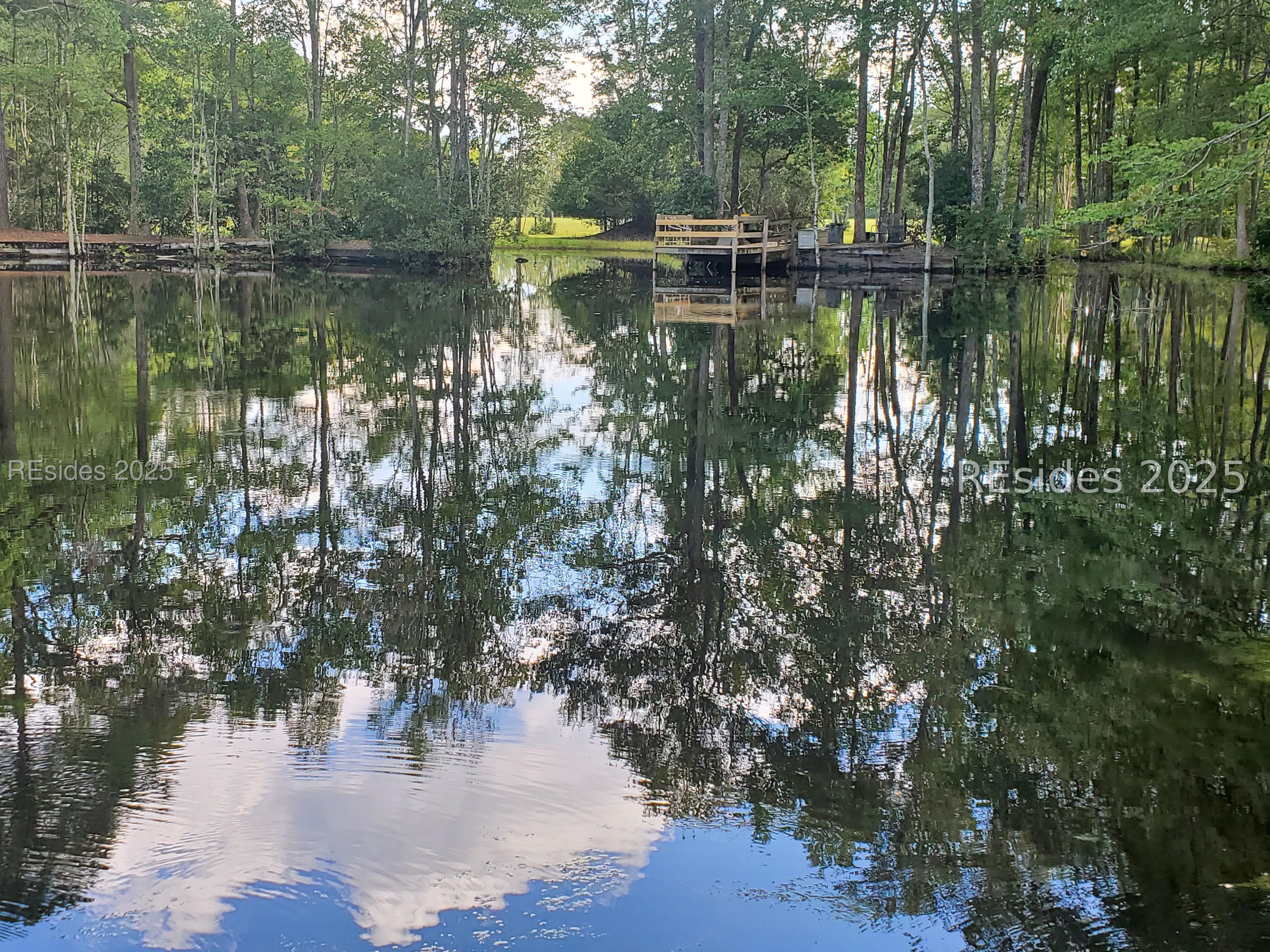 1 Acre stocked fishing pond with dock!