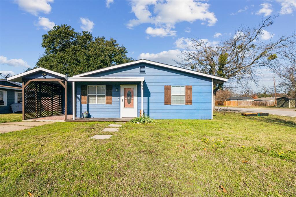 902 Turner Street Cleburne, TX 76033 - Photo 30 of 33 a front view of a house with garden