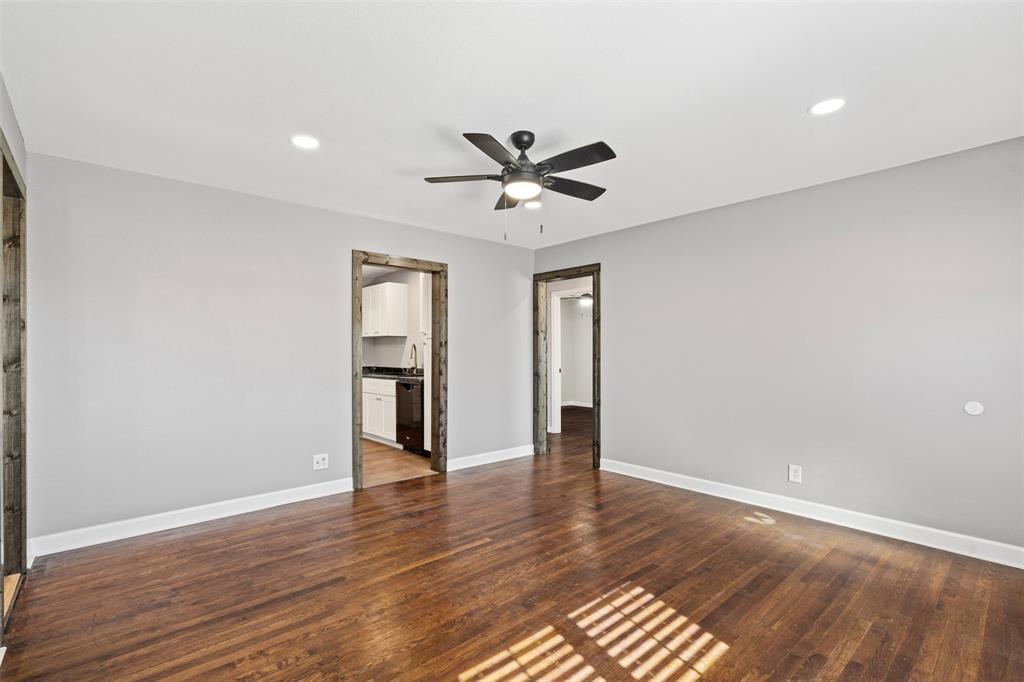 902 Turner Street Cleburne, TX 76033 - Photo 7 of 33 wooden floor in an empty room with a window