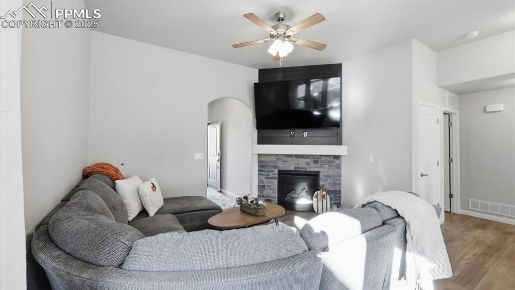 4456 Hessite Loop Colorado Springs, CO 80938 - Photo 11 of 42 a living room with furniture and a fireplace