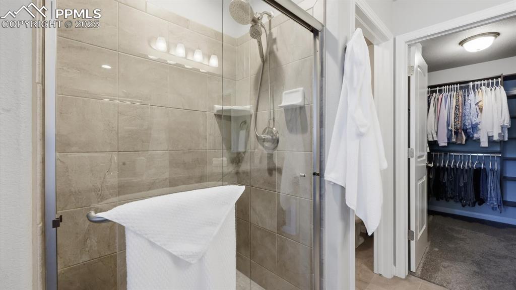4456 Hessite Loop Colorado Springs, CO 80938 - Photo 23 of 42 a bathroom with a sink and shower