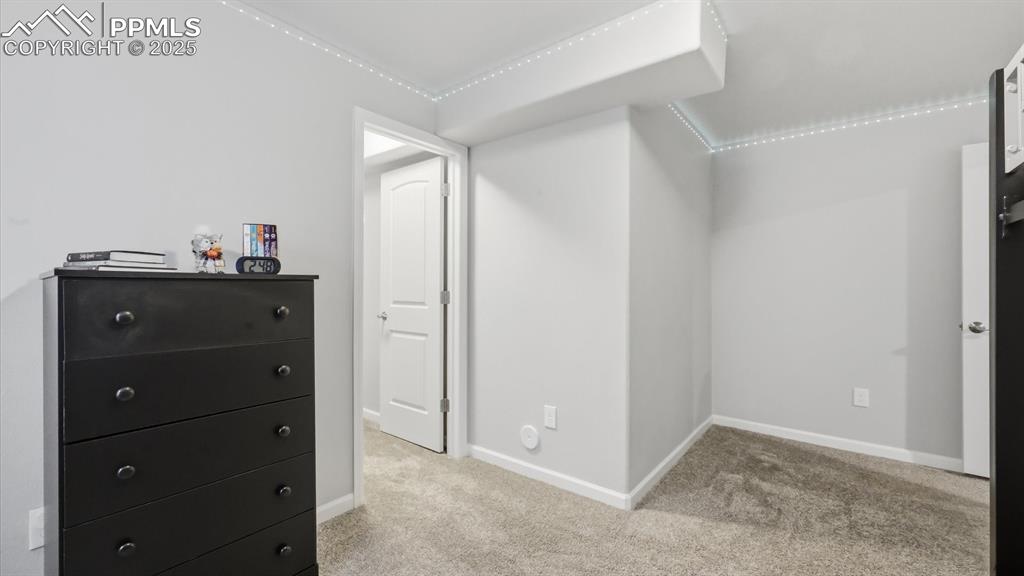 4456 Hessite Loop Colorado Springs, CO 80938 - Photo 29 of 42 a room with a dresser