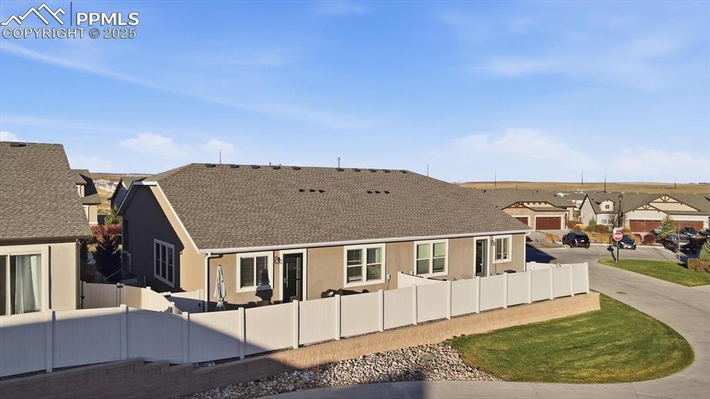 4456 Hessite Loop Colorado Springs, CO 80938 - Photo 40 of 42 a view of a big house with a big yard