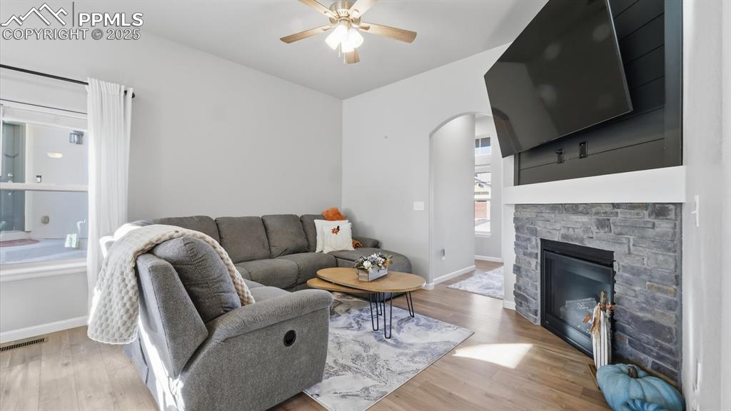 4456 Hessite Loop Colorado Springs, CO 80938 - Photo 10 of 42 a living room with furniture and a fireplace