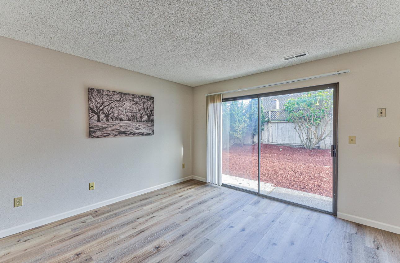 2 Geary Circle Salinas, CA 93907 - Photo 12 of 29 an empty room with wooden floor and windows