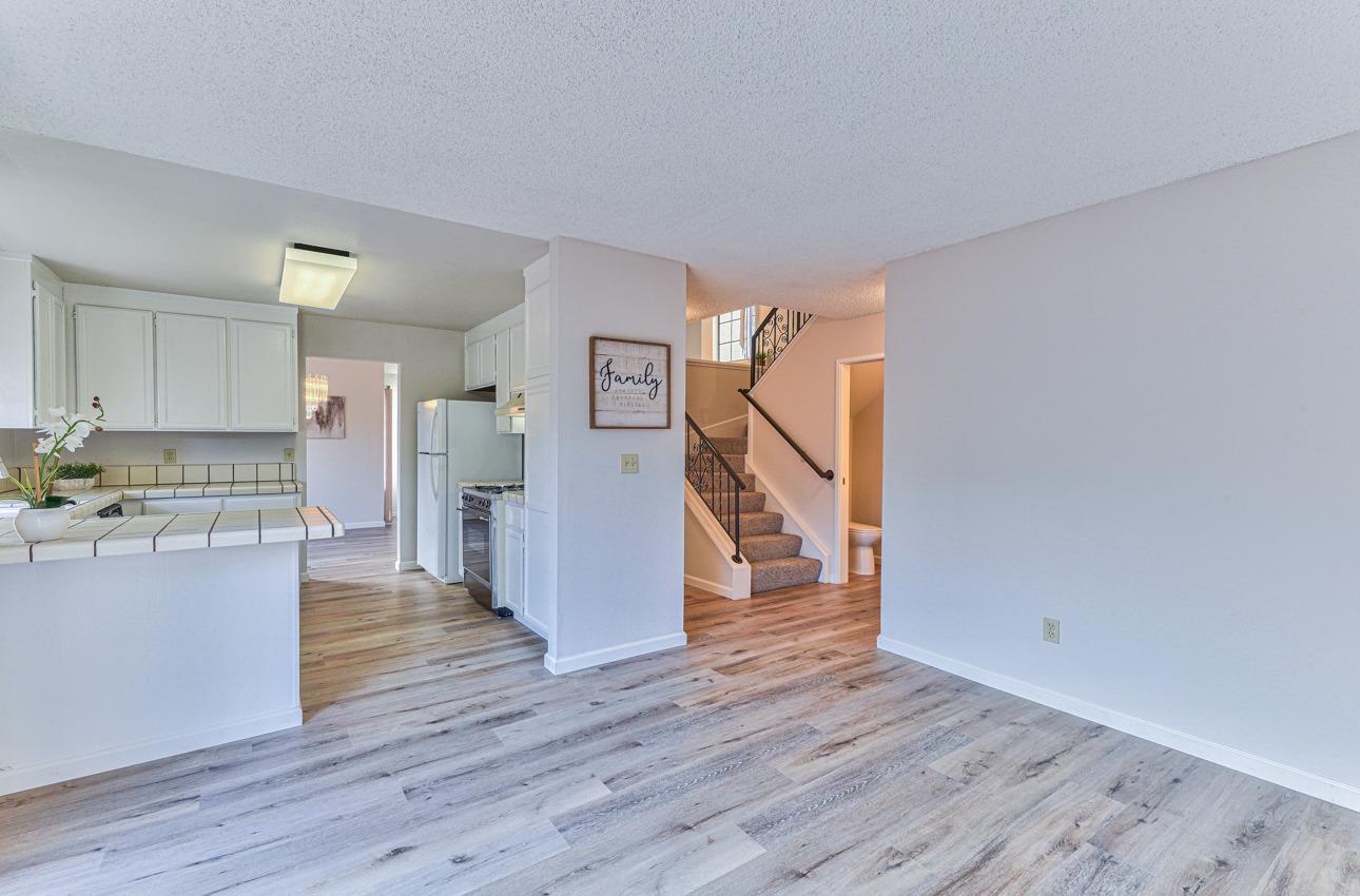 2 Geary Circle Salinas, CA 93907 - Photo 13 of 29 a view of a kitchen and an empty room with wooden floor