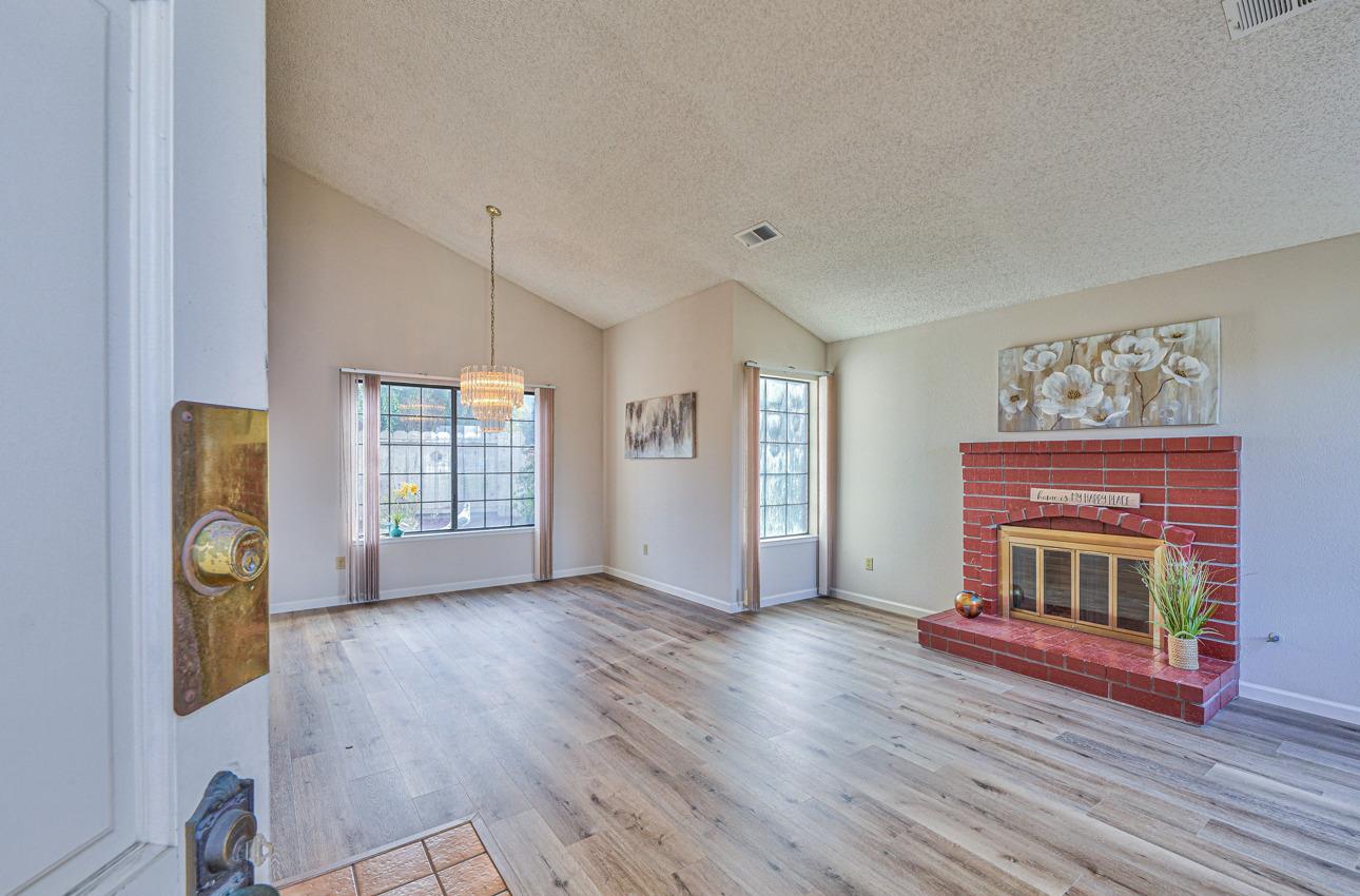 2 Geary Circle Salinas, CA 93907 - Photo 2 of 29 a view of an empty room with window and wooden floor