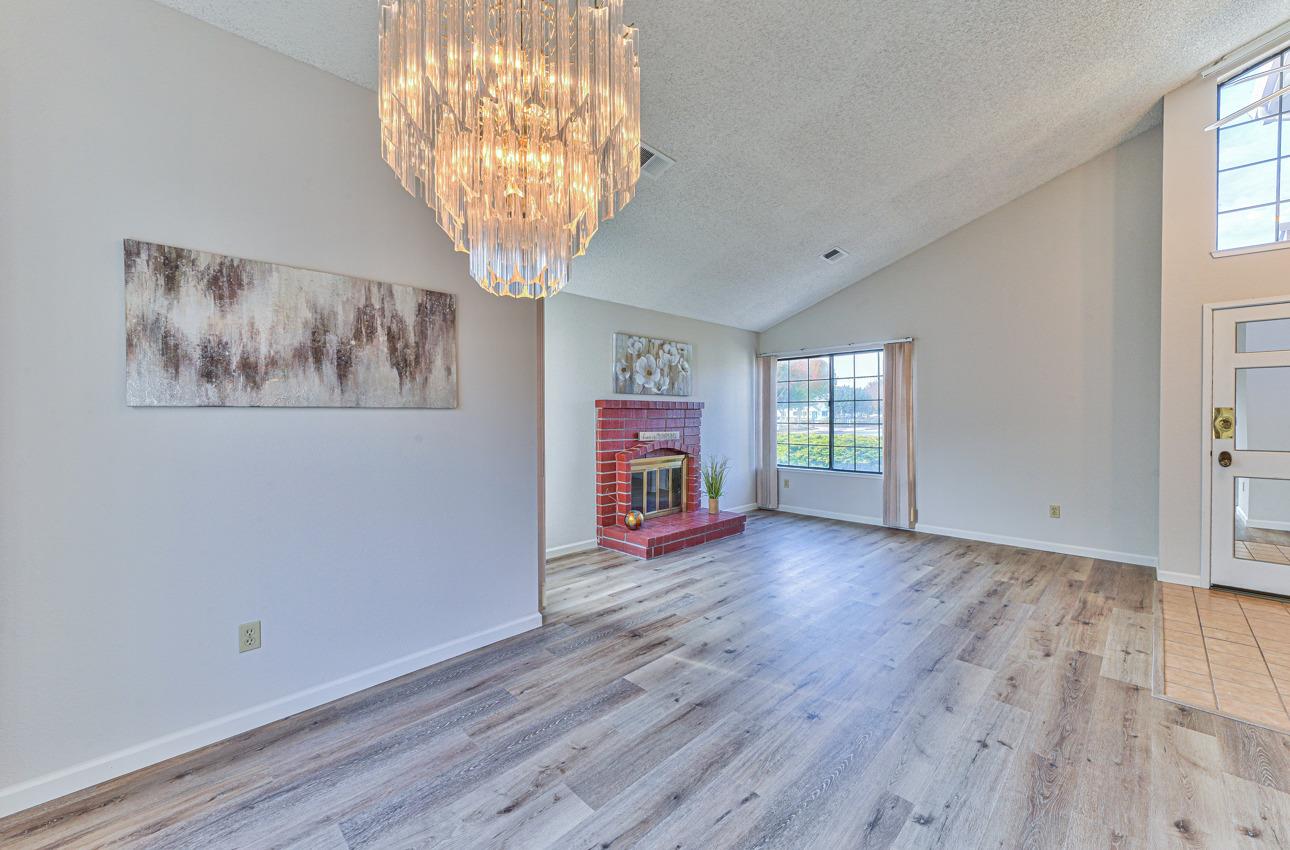 2 Geary Circle Salinas, CA 93907 - Photo 7 of 29 an empty room with wooden floor and windows
