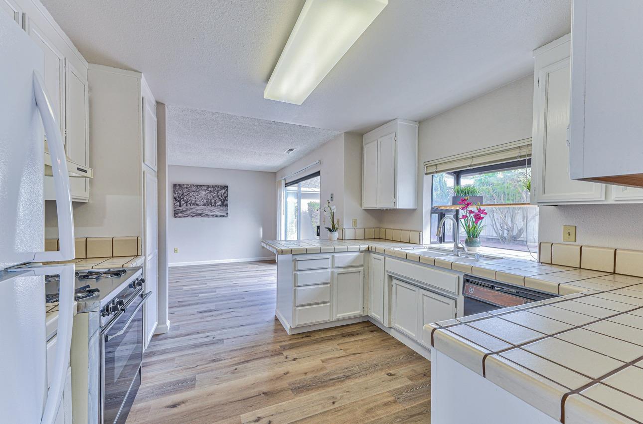 2 Geary Circle Salinas, CA 93907 - Photo 8 of 29 a kitchen with a sink stove and cabinets