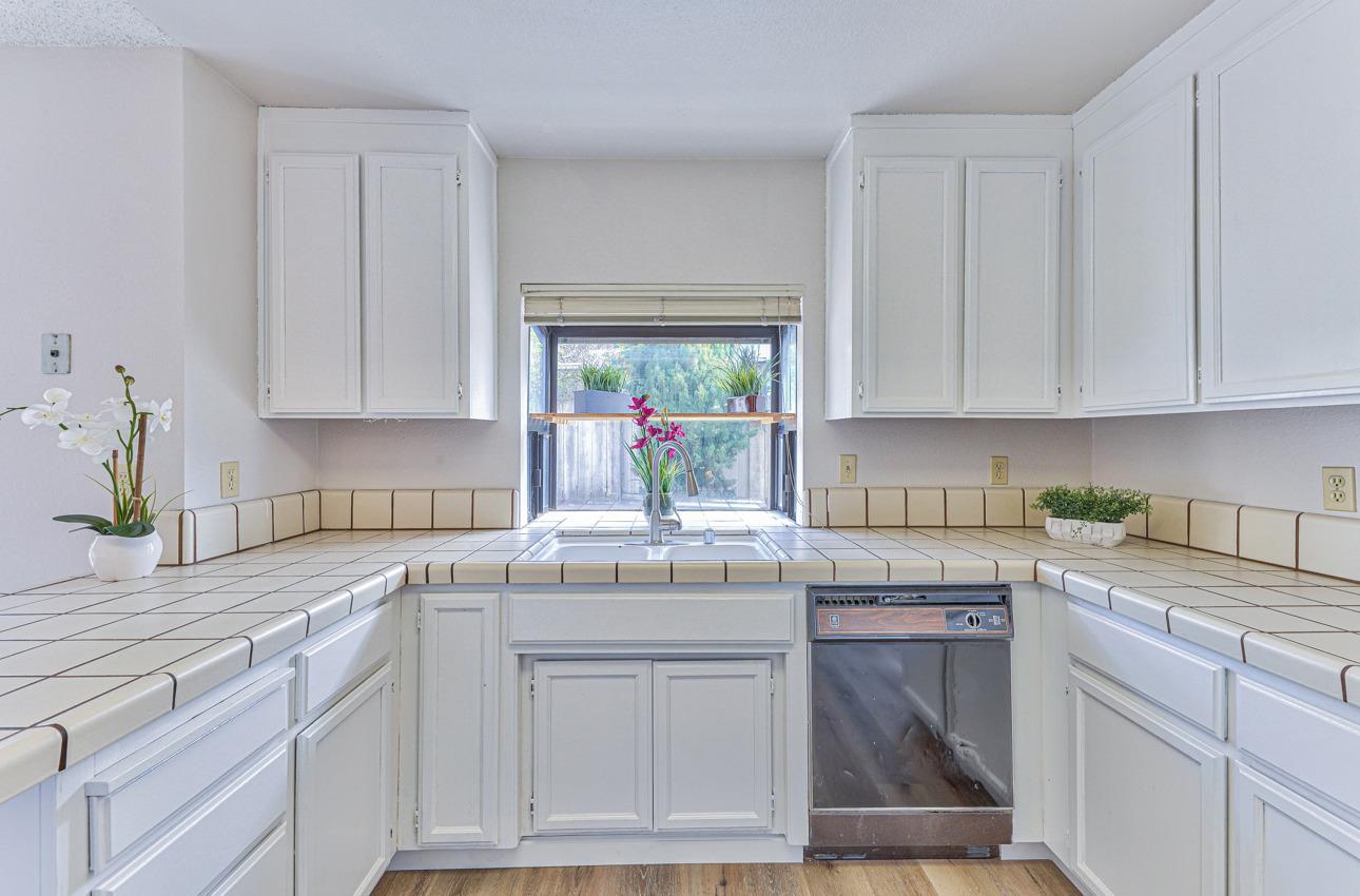 2 Geary Circle Salinas, CA 93907 - Photo 10 of 29 a kitchen with cabinets appliances a sink and a window
