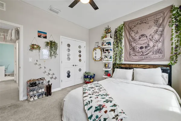 a bedroom with furniture and a large mirror