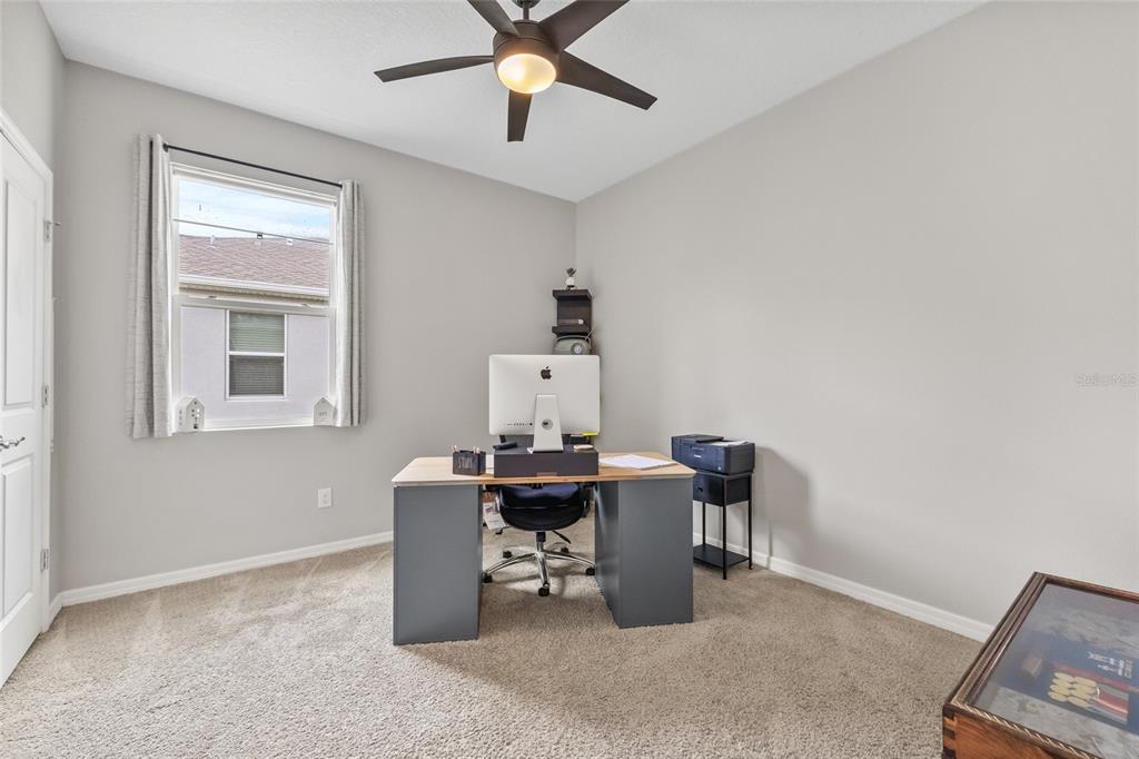 13675 Paddington Way Spring Hill, FL 34609 - Photo 26 of 36 a workspace with furniture and window