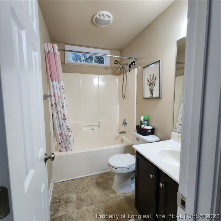 332 United Road Raeford, NC 28376 - Photo 13 of 31 a bathroom with a sink a toilet and shower