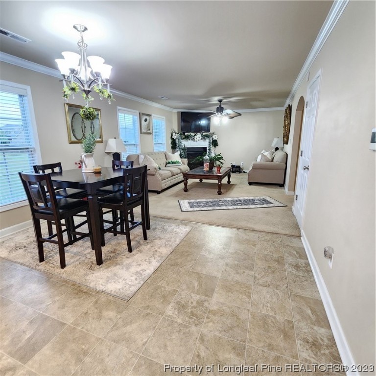 332 United Road Raeford, NC 28376 - Photo 19 of 31 a view of a dining room with furniture and chandelier