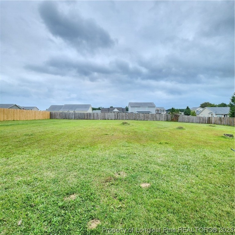 332 United Road Raeford, NC 28376 - Photo 2 of 31 a view of a large pool with lawn chairs and large trees