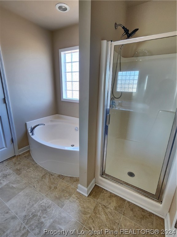 332 United Road Raeford, NC 28376 - Photo 28 of 31 a bathroom with a tub and shower