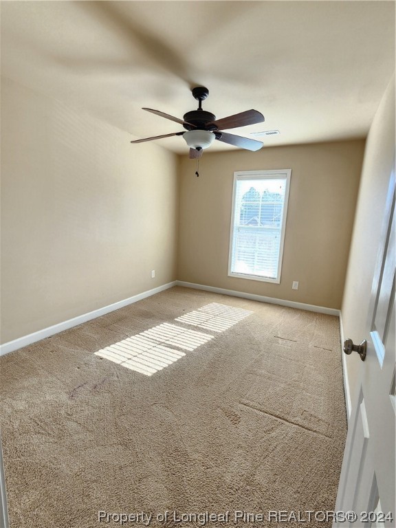 332 United Road Raeford, NC 28376 - Photo 30 of 31 a view of a livingroom with a ceiling fan and window