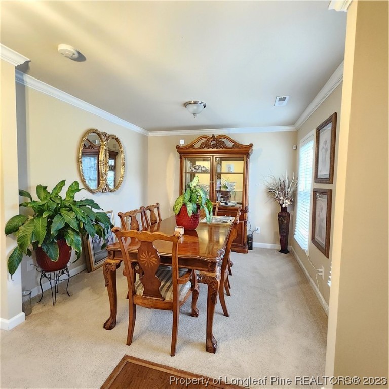 332 United Road Raeford, NC 28376 - Photo 6 of 31 a view of a dining room with furniture window and wooden floor