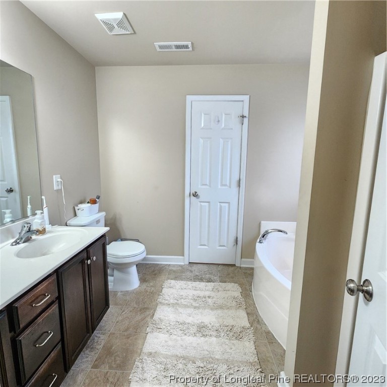 332 United Road Raeford, NC 28376 - Photo 7 of 31 a bathroom with a sink and a toilet