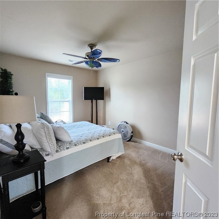 332 United Road Raeford, NC 28376 - Photo 8 of 31 a bed sitting in a bedroom next to a window